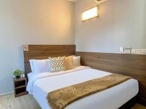 Voodi või voodid majutusasutuse ST Signature Bugis Beach, DAYUSE, 5 Hours, 4PM-9PM toas