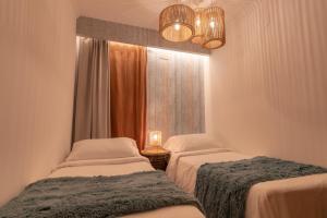 A bed or beds in a room at Villa Arai by Villalia Még 12 kép