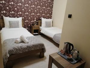 Postel nebo postele na pokoji v ubytování Apartmani CENTAR- Smederevo