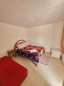 Pousada Rir Sorte Praia de Jacaraípe tesisinde bir odada yatak veya yataklar