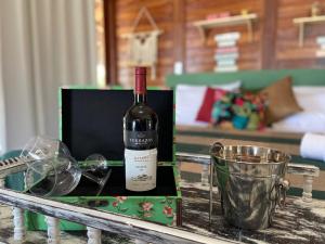 a bottle of wine in a box on a table at Pousada Portal do Kite in Tatajuba
