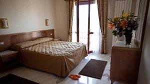 Postel nebo postele na pokoji v ubytování Antella Residence