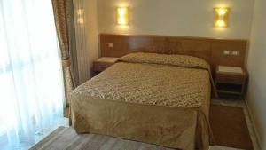 Postel nebo postele na pokoji v ubytování Antella Residence