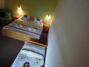 Postel nebo postele na pokoji v ubytování Pension Apartmány Sport Čermák