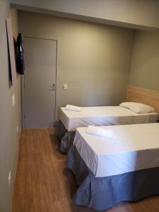 Llit o llits en una habitació de Unity Hotel - Vila Mariana SP