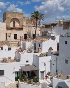 a view of the rooftops of white buildings at VIA DANTE LUXURY in Matino