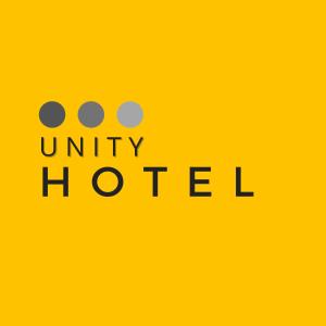 a yellow sign with the text unity hated at Unity Hotel - Vila Mariana SP in São Paulo