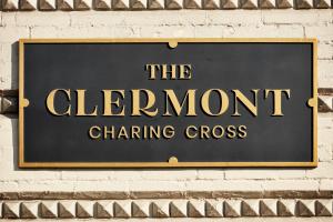 a sign on a brick wall that reads the element changing cross at The Clermont London, Charing Cross in London