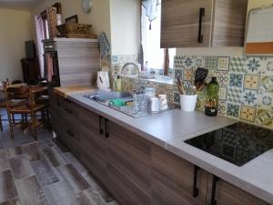 a kitchen with a sink and a counter top at Beautiful 2-Bed House in Saint-Leger-Magnazeix in Saint-Léger-Magnazeix
