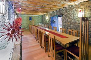 a dining room with a long table and chairs at Gulevi Safranbolu in Safranbolu