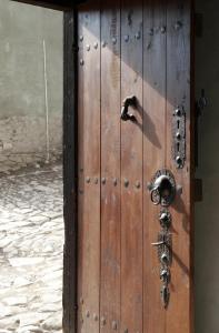 
a wooden door leading to a small room at Gulevi Safranbolu in Safranbolu
