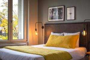 Ένα ή περισσότερα κρεβάτια σε δωμάτιο στο Hello Colmar, Duplex Cathedrale, historic center