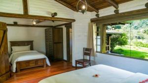 Łóżko lub łóżka w pokoju w obiekcie En Casa de Luis