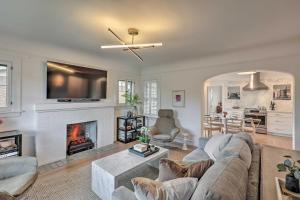 a living room with a couch and a fireplace at Reno Home Less Than 1 Mile to Midtown and Truckee River in Reno