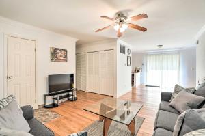 a living room with a couch and a ceiling fan at Glendale Heights Home with Office and Backyard! in Glendale Heights