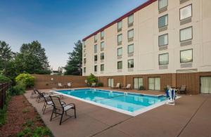The swimming pool at or close to Red Roof Inn PLUS Boston - Mansfield - Foxboro