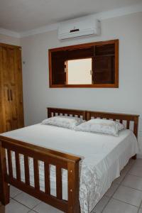 Giường trong phòng chung tại casa em Barra de Cunhaú-RN