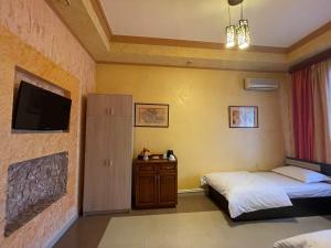 Postel nebo postele na pokoji v ubytování KangAr guest house + 23 fotografií