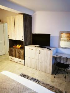 TV a/nebo společenská místnost v ubytování Casa Flandria
