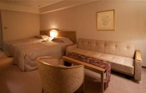 Tempat tidur dalam kamar di Bellino Hotel Ichinoseki