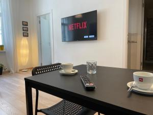 Televízia a/alebo spoločenská miestnosť v ubytovaní Residence Neverin Trieste