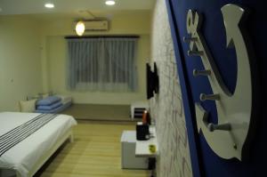Een bed of bedden in een kamer bij Meet ‧ Happiness B&B