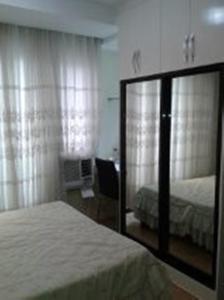 Postel nebo postele na pokoji v ubytování The Oasis Davao Condotel