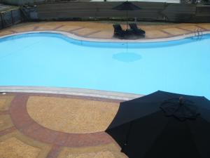 Bazén v ubytování The Oasis Davao Condotel nebo v jeho okolí