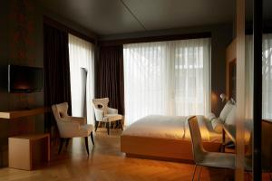 Postel nebo postele na pokoji v ubytování Amadi Park Hotel