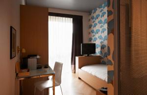 Postel nebo postele na pokoji v ubytování Amadi Park Hotel