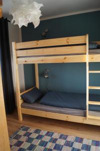 a bunk bed with blue pillows in a room at Ferienhaus Inntal in Kiefersfelden
