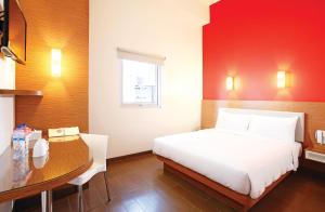 Postel nebo postele na pokoji v ubytování Amaris Hotel Samarinda