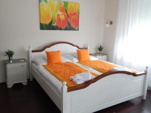 Postel nebo postele na pokoji v ubytování Bogácsa Apartman
