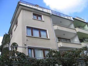 a building with balconies on the side of it at Guest House Preslav in Nesebar