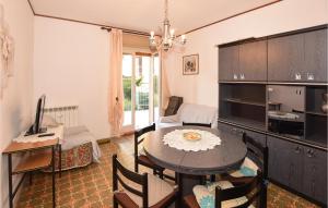 a living room with a table and a dining room at Nice Apartment In Chatillon With Wifi in Châtillon