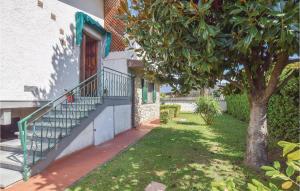 a stairway leading to a door of a house with a tree at Villetta Della Pace in Lido di Camaiore
