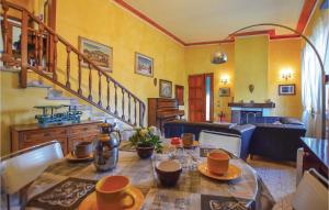 a dining room with a table with cups on it at Villetta Della Pace in Lido di Camaiore
