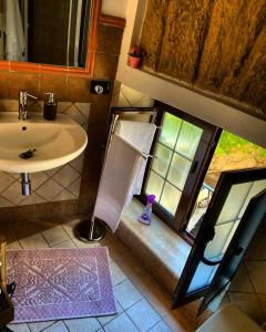 an overhead view of a bathroom with a sink and a window at La Trinacria in Agrigento