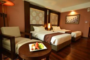 Katil atau katil-katil dalam bilik di Rose Garden Hotel