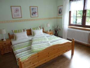Кровать или кровати в номере Ferienwohnung Lotti