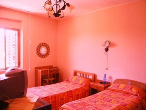 Postel nebo postele na pokoji v ubytování B&B La Pineta