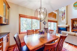 a kitchen and dining room with a wooden table and chairs at 102 Morningstar Circle in Frisco
