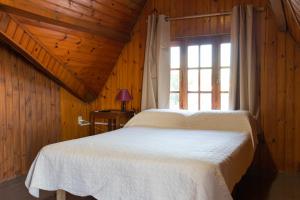 Säng eller sängar i ett rum på Hotel Amazonas