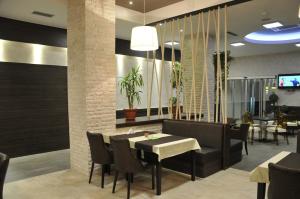 a dining room with a table and chairs at Hotel Malta in Mostar