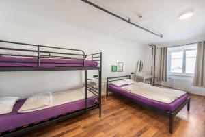 Postel nebo postele na pokoji v ubytování AdHoc Hostel