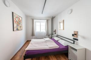 Postel nebo postele na pokoji v ubytování AdHoc Hostel