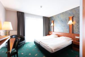 Postel nebo postele na pokoji v ubytování Hotel Freihof