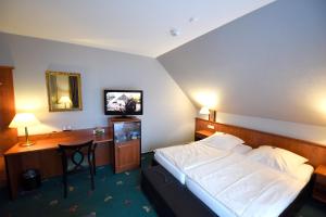 Postel nebo postele na pokoji v ubytování Hotel Freihof