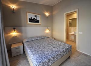 Postel nebo postele na pokoji v ubytování Domu Noa Hotel