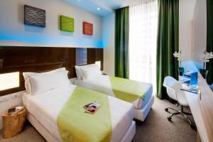 Postel nebo postele na pokoji v ubytování Hotel degli Arcimboldi